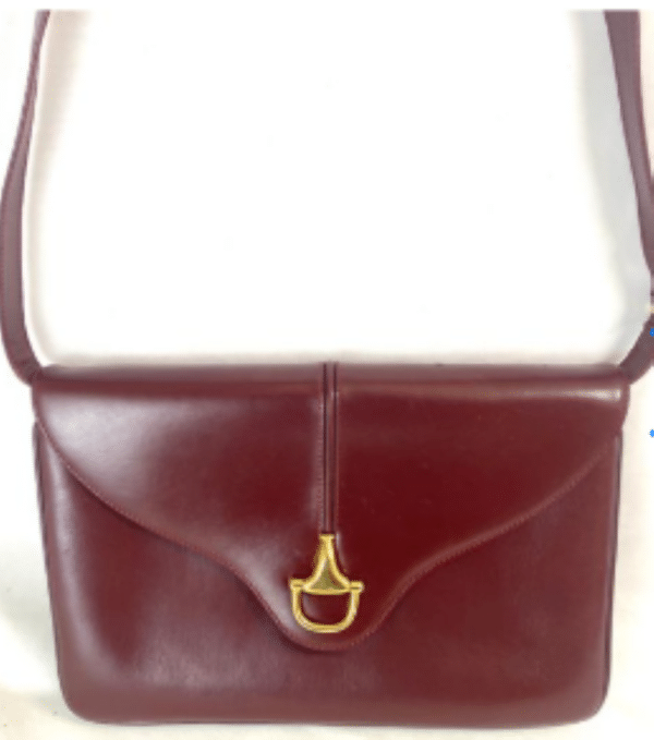 Screenshot 2026-02-06 083313 Vintage Gucci Burgundy Leather Equestrian Stirrup Clasp Shoulder Bag