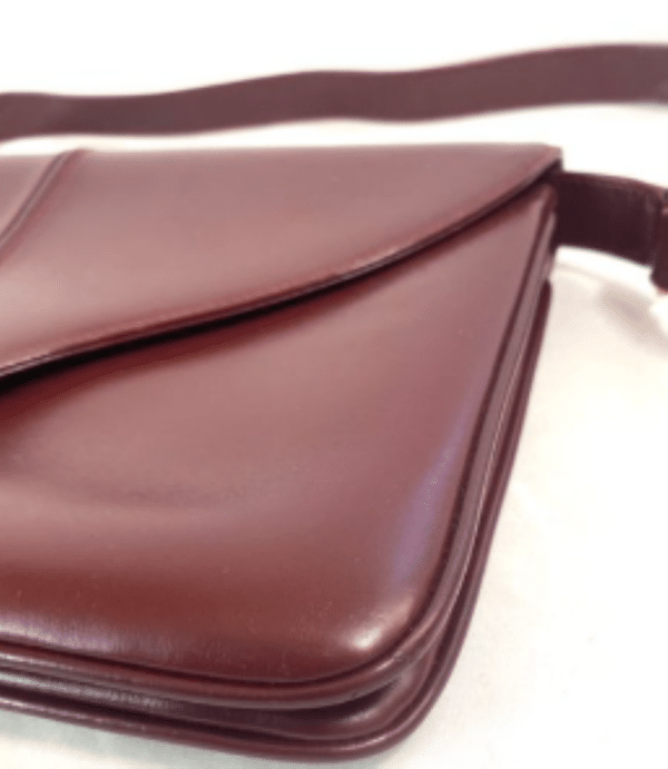Screenshot 2026-02-06 083339 Vintage Gucci Burgundy Leather Equestrian Stirrup Clasp Shoulder Bag