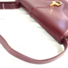 Screenshot 2026-02-06 083348 Vintage Gucci Burgundy Leather Equestrian Stirrup Clasp Shoulder Bag