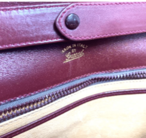 Screenshot 2026-02-06 083405 Vintage Gucci Burgundy Leather Equestrian Stirrup Clasp Shoulder Bag