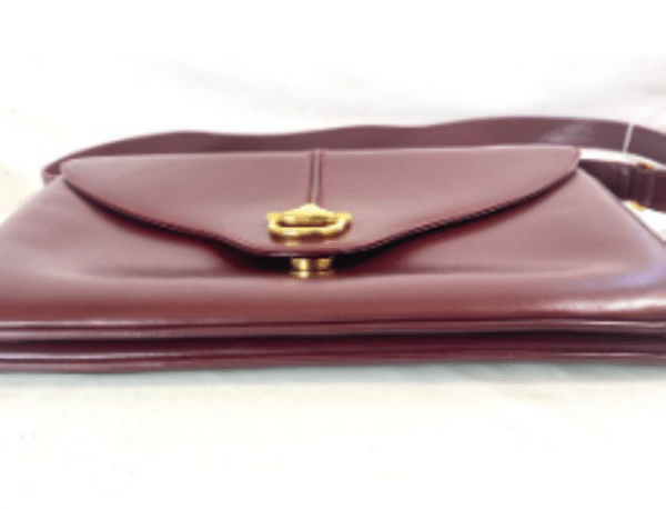 Screenshot 2026-02-06 083416 Vintage Gucci Burgundy Leather Equestrian Stirrup Clasp Shoulder Bag