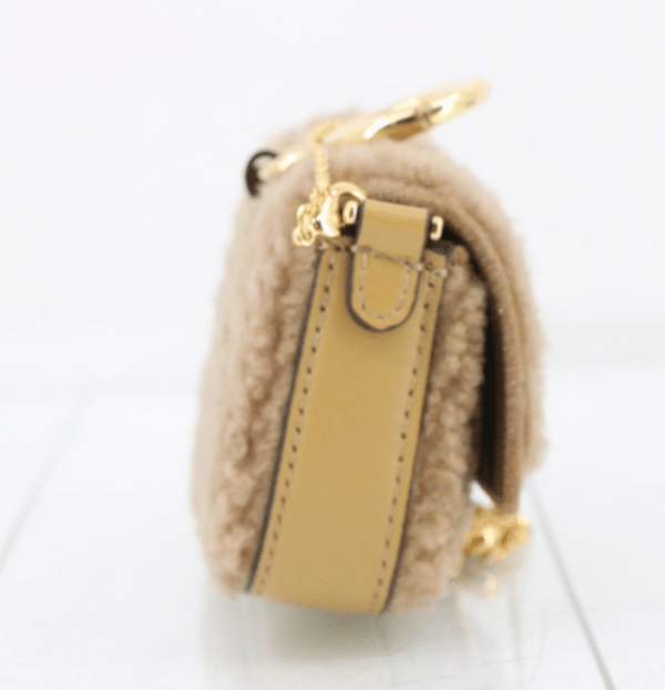 Screenshot 2026-02-24 070851 Fendi Nano Baguette Beige Shearling Gold Chain Crossbody Bag