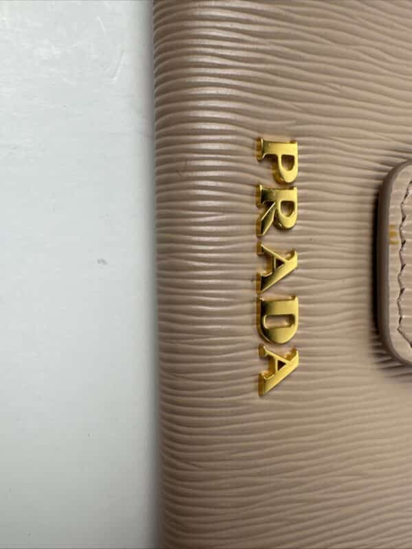 2026-04-26 15.30.34 Prada Beige Textured Leather Card Holder Zip Coin Case Gold Logo