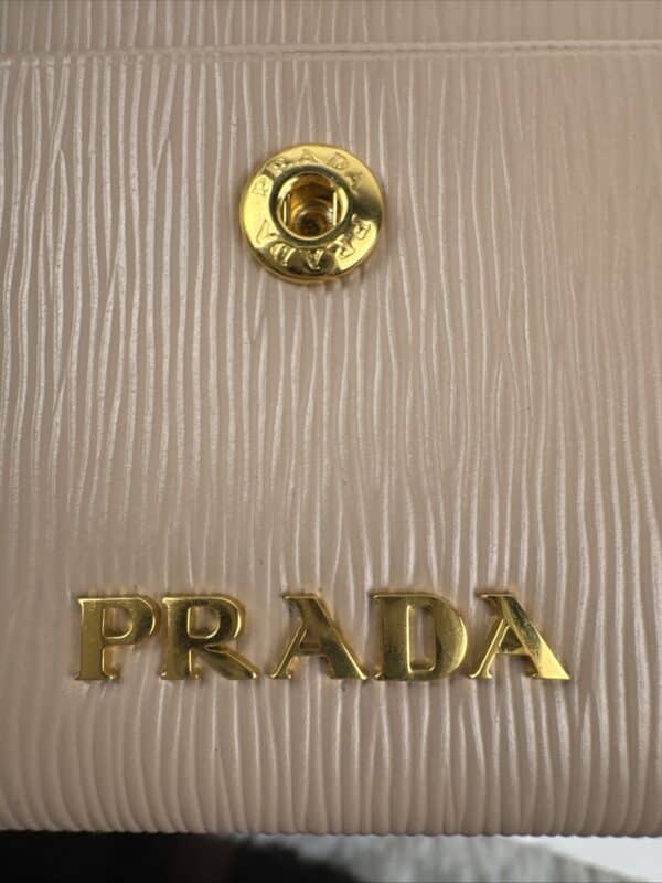 2026-04-26 15.44.11 Prada Beige Textured Leather Card Holder Zip Coin Case Gold Logo