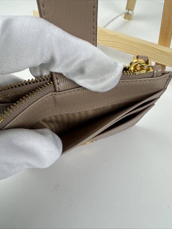2026-04-26 15.44.20 Prada Beige Textured Leather Card Holder Zip Coin Case Gold Logo