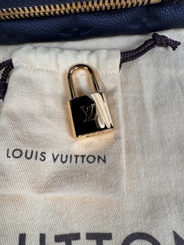 p1-249.jpg Louis Vuitton Pétillante Clutch in Bleu Infini Monogram Empreinte Leather, M93425