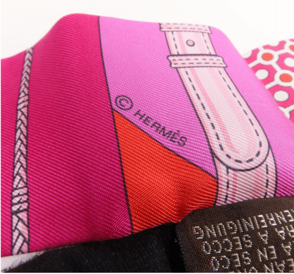 Screenshot 2026-08-30 161846 Hermès Twilly Silk Scarf – Pink, Red & Purple Geometric Equestrian Print