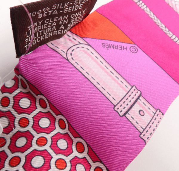 Screenshot 2026-08-30 161909 Hermès Twilly Silk Scarf – Pink, Red & Purple Geometric Equestrian Print