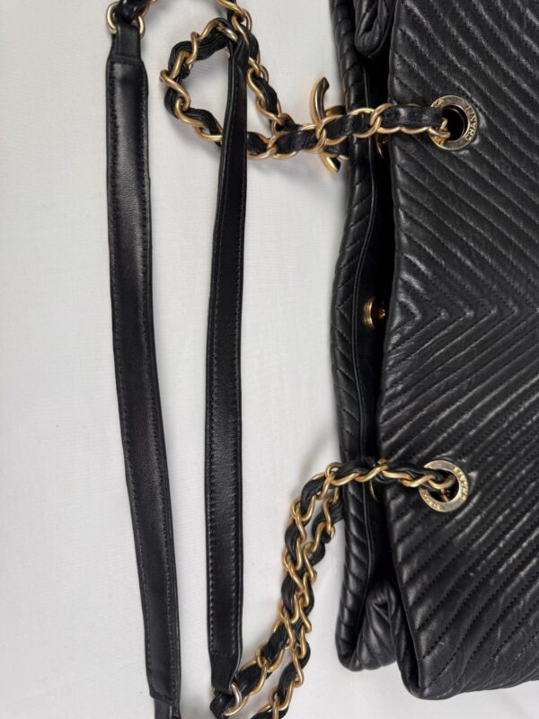 p1-230.jpg Chanel Surpique Chevron Calfskin CC Charm Black Leather Large Shopping Tote